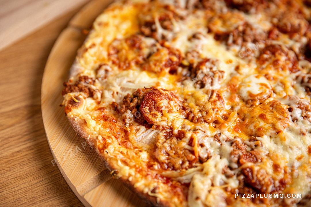Close-up of a golden pizza fresh from the oven